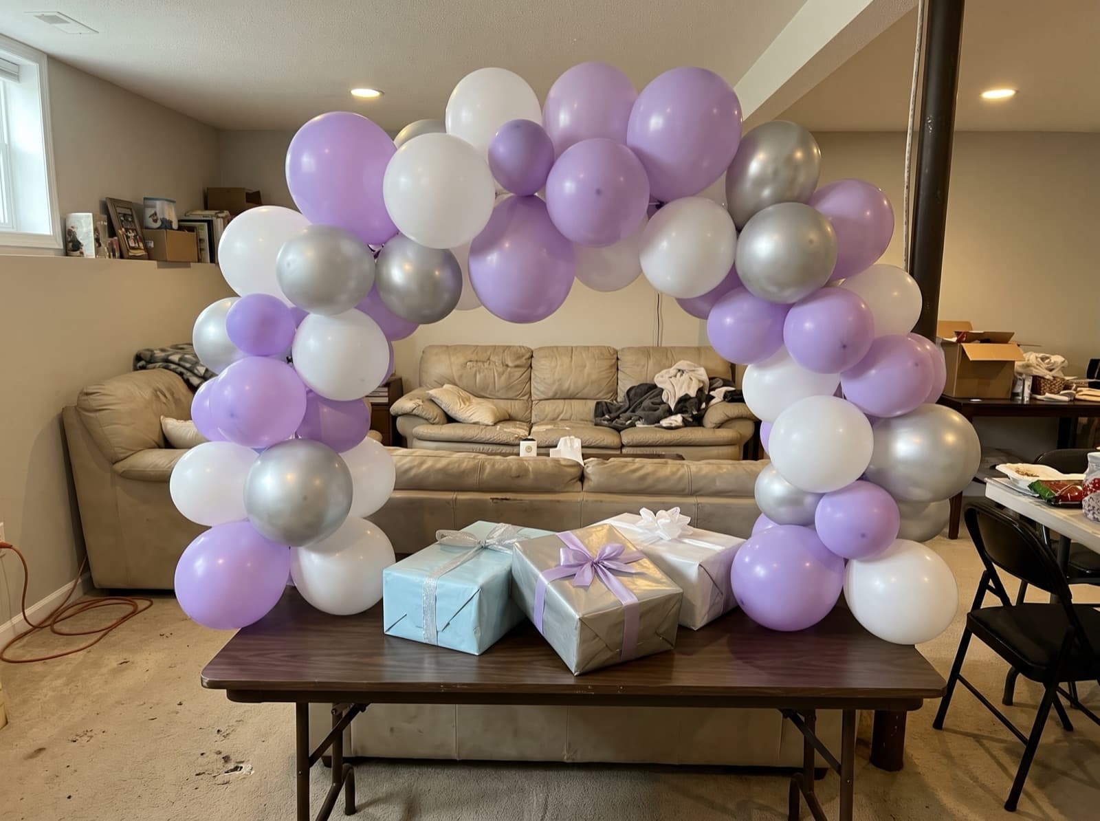 Mini tabletop balloon arch over a gift table