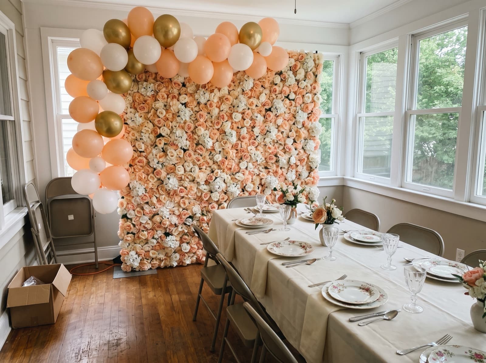 Flower wall backdrop with ivory and peach balloons