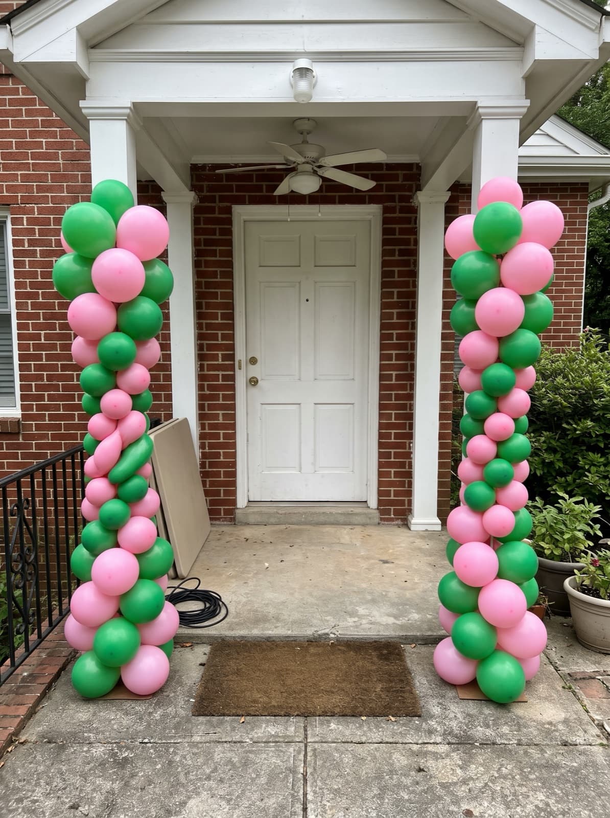 Pair of spiral balloon columns at a front door