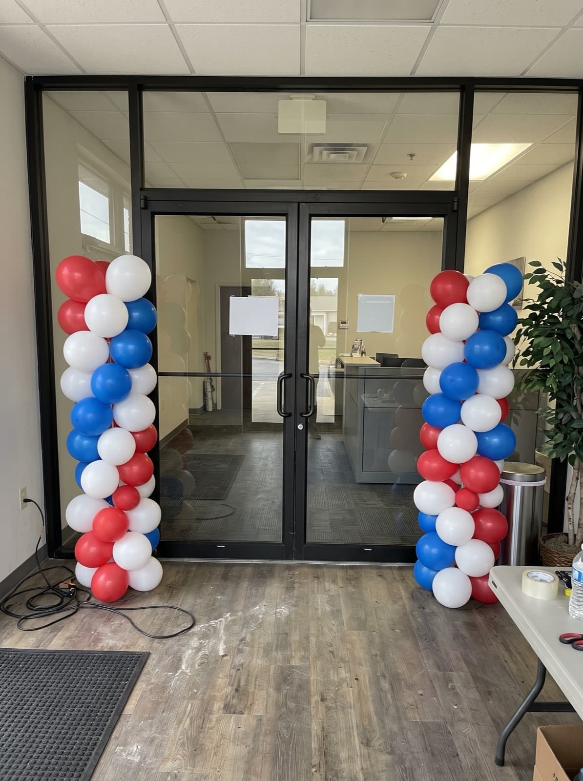 Red, white and blue spiral balloon columns