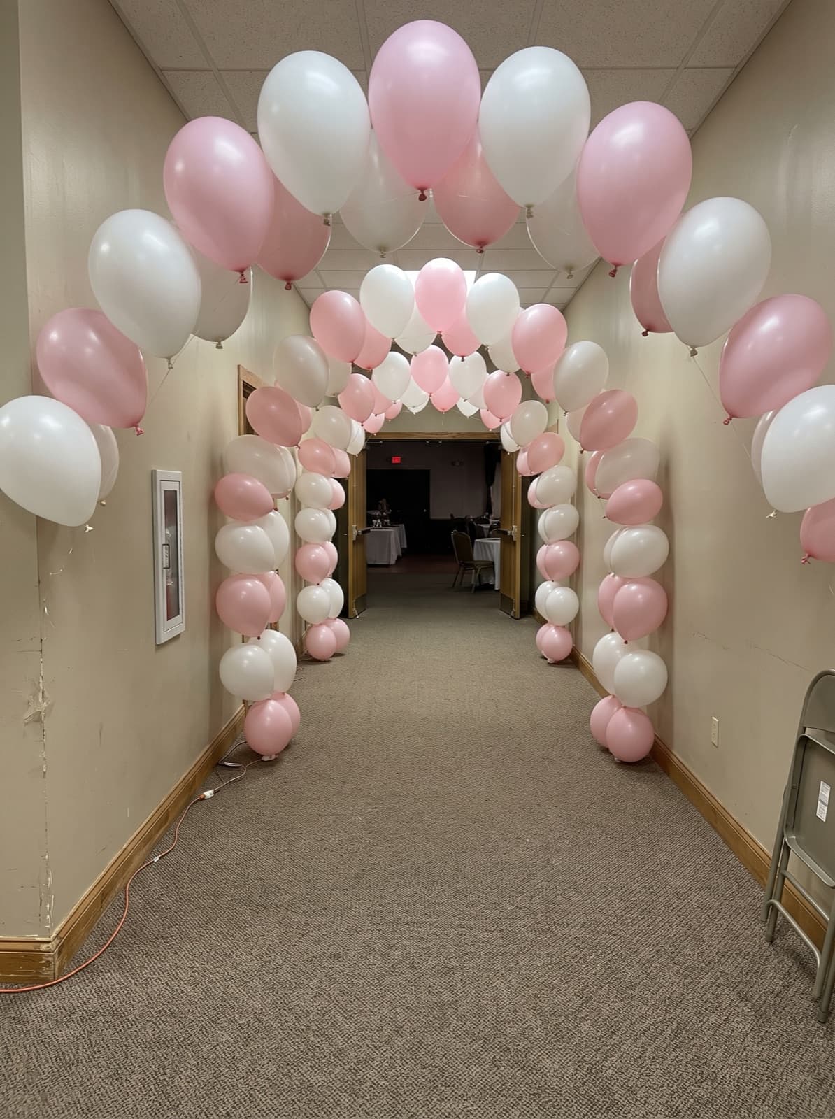 Balloon tunnel of linked arches at an entrance