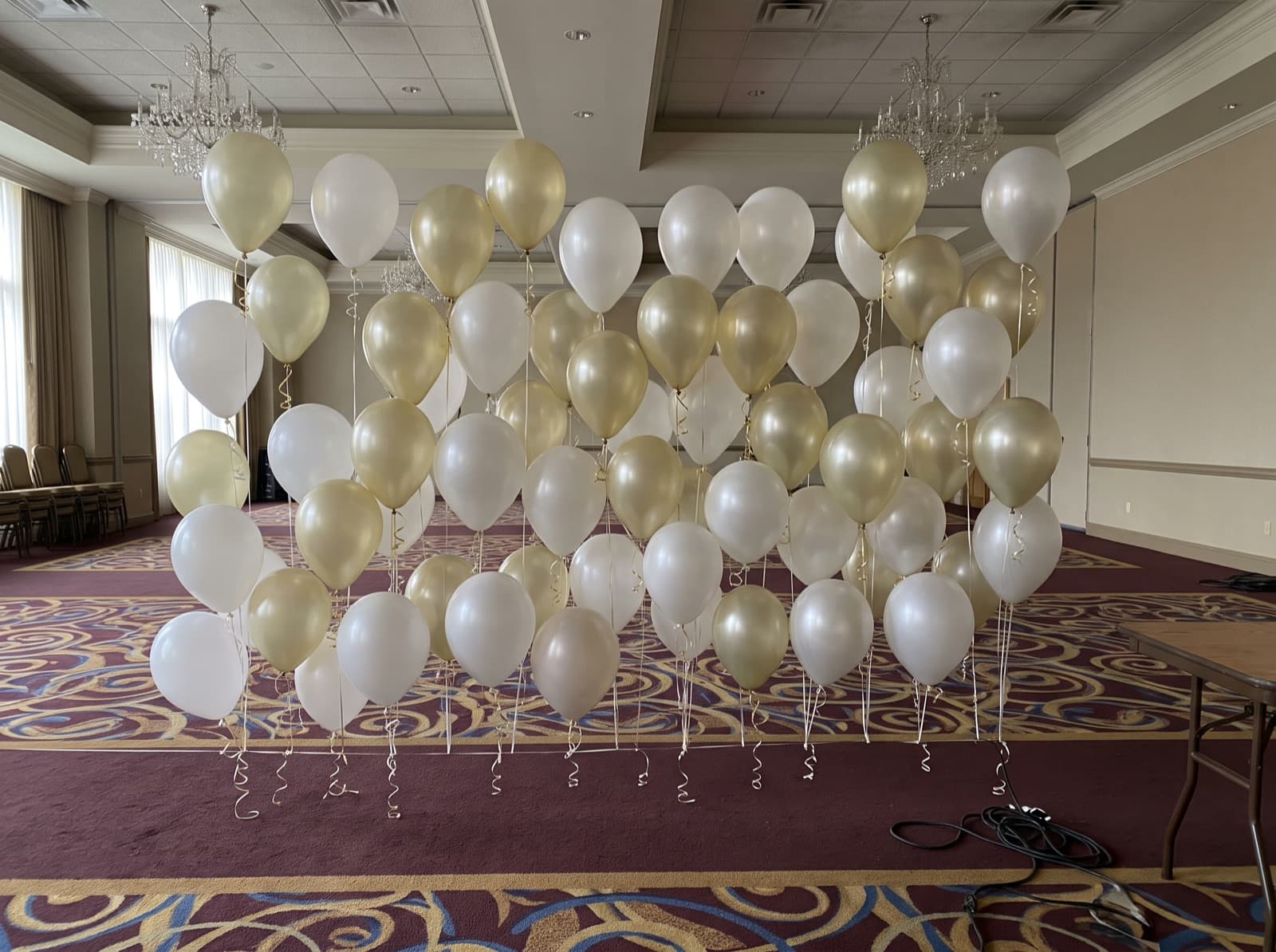 Floating helium balloon wall with ribbons